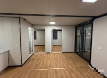 Container house with insulated walls and waterproof finish