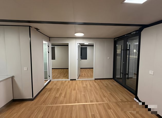 Container house with insulated walls and waterproof finish